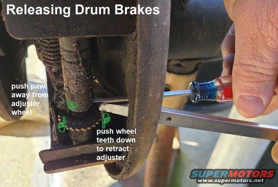 drumrelease.jpg How to release drum brakes (drum removed for clarity) if the drum cannot be slipped off.
IF THE IMAGE IS TOO SMALL, click it.

Use a screwdriver or other tool to hold the pawl off the adjuster teeth, while using another to spin the wheel down (1/2-ton FS trucks; other vehicles may spin the other way).