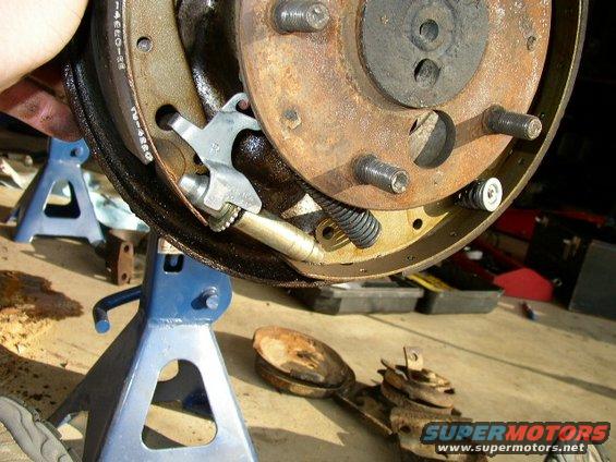 Close-up of brake drum and shoes on jack stands