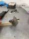 1968 Mercury Cougar - A close-up of a worn fuel pump sits on a workbench next to various tools and debris.