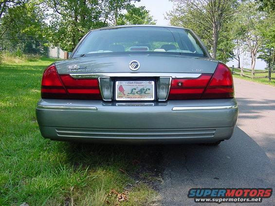 The dealer name plate has been removed since this shot was taken. This is a good view of the new tail light and trunk fascia treatment. 