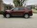 2016 Ford Explorer - Maroon 2016 Ford Explorer parked in front of a brick house with a basketball hoop in the background.