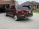 2016 Ford Explorer - This maroon 2016 Ford Explorer is parked in a driveway, showing its rear profile and license plate.