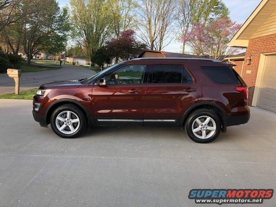 2016 Ford Explorer side view, parked on concrete driveway