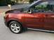 2016 Ford Explorer - 2016 Ford Explorer shown from the side, parked on a paved surface with a residential street in the background.