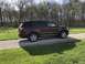 2016 Ford Explorer - This Ford Explorer is parked on a gravel driveway with a grassy area and trees in the background.