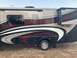 2015 Ford F-550 - This RV, labeled "FLAIR", is parked outdoors on a grassy area with stabilizers deployed.