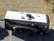 2015 Ford F-550 - Motorhome with 'FLAIR' graphics is parked in a lot.