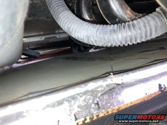 close-up of a refrigerator's cooling fins and fan
