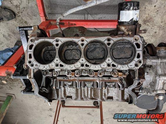 pxl_20210722_011723336.jpg Heads Removed. Tons of Carbon deposits. Possibly due to EGR and Smog pump delete. Very dirty, but no measurable wear! We'll stick to  honing and new rings.