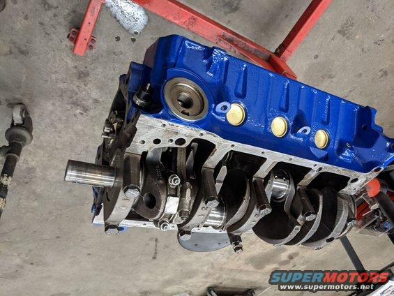 Finally going back together after the block was cleaned, honed, and painted. Pistons got new moly rings, crank polished, and new clevite bearings. 