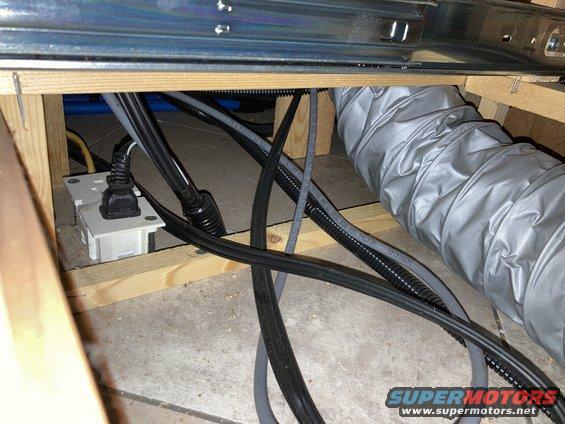 Electrical outlet and wiring behind cabinets
