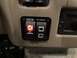 2015 Ford F-550 - Close-up of dashboard switches labeled 'Navigation & Dash Cam' and 'Side Cameras', with the 'GPS Dashcam' button illuminated.
