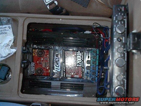picture-012.jpg First 4 channel amp is split to power all 4 tweeters. The other half powers both 6 1/2" mid ranger components in doors. Note old tech 6 channel crossover mounted on inside of console lid(out of focus).