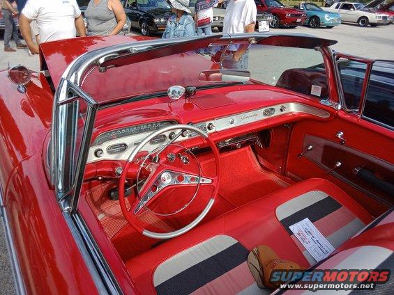 a 58 Impala with fender mounted side view mirrors called "halo mirrors."