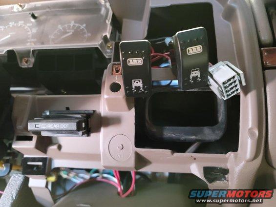 Dashboard with ARB switches for off-road traction control and a rear defroster button