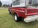 2002 Ford Excursion - This vintage Ford pickup truck is equipped with a camper shell and dual rear wheels.
