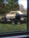 1963 Ford Galaxie - The body of a 1963 Ford Galaxie is seen on a trailer, undergoing restoration or transport.