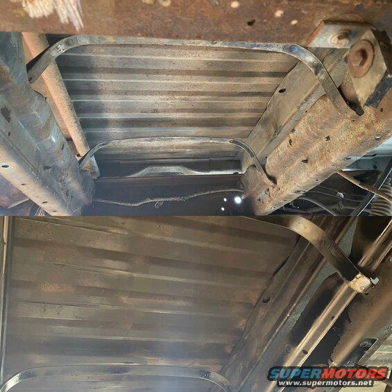 Undercarriage view showing fuel tank straps and frame rails. Watermark reads SUPERMOTORS.NET