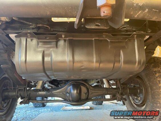 Underside view of a vehicle's fuel tank and rear axle assembly