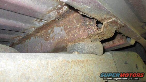 rusted frame rails and crossmember of a vehicle