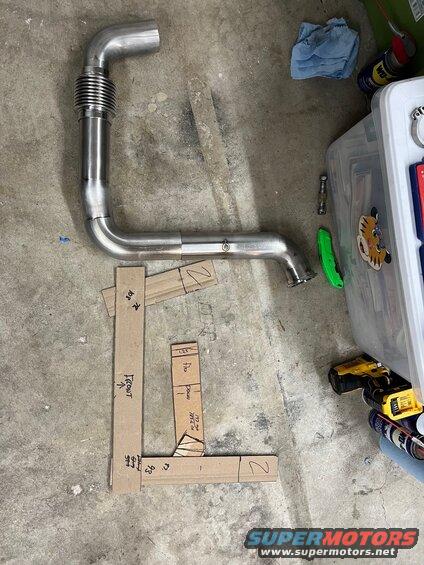 22-mock-up.jpg Crossover pipe tacked into the major bends. Makes it easier to get angles right when you are mocking it up in the car. Sitting next to the cardboard sections which were pretty accurate. 