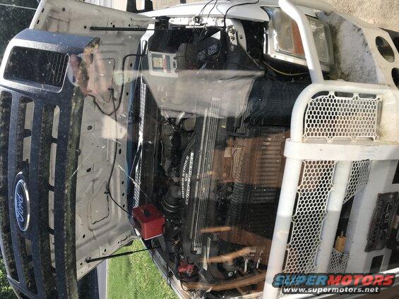 White 2008 Ford F-250 engine bay with hood open