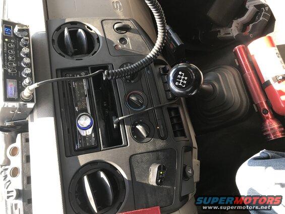Truck interior with CB radio, JVC stereo, and manual shifter