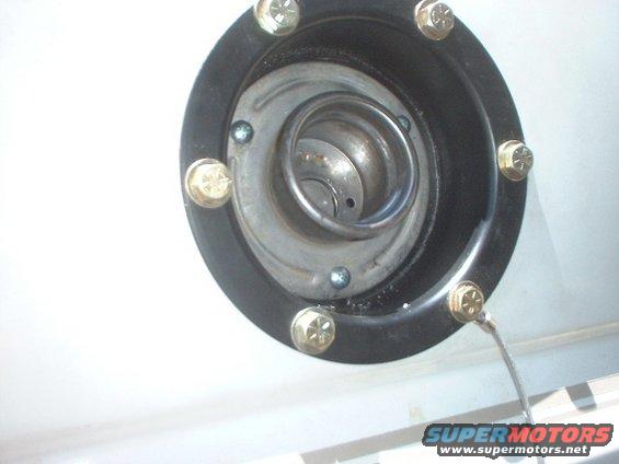 tank17.jpg used another holesaw to remove the filler neck and slipped on the stock bronco filler. used 3 self tapping screws to hold it on.