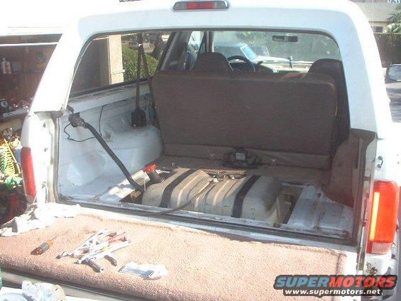 tank19.jpg Used some rubber straps to hold the tank down and some rubber under the tank to seperate it from the skid.