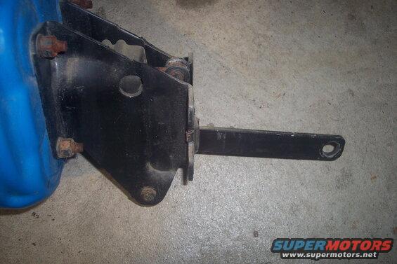 Blue brake booster with black metal bracket and pushrod