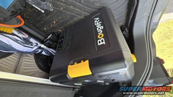 With BougeRV cooler. Solar panel charges onboard battery and/or powers fridge. 