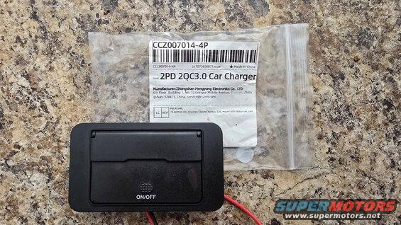 Black car charger with "ON/OFF" text and red wires, next to packaging