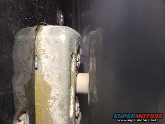 strike1.jpg Strike Bolt Position
IF THE IMAGE IS TOO SMALL, click it.

After the t/g is aligned on its hinges to the body, the strike bolts must be aligned so they meet the centers of the latches by watching through the gaps while slowly closing the t/g.