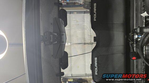 Polaris side-by-side vehicle parked in a garage