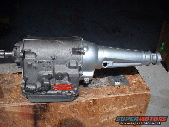 Silver automatic transmission with red oval tag and visible part numbers