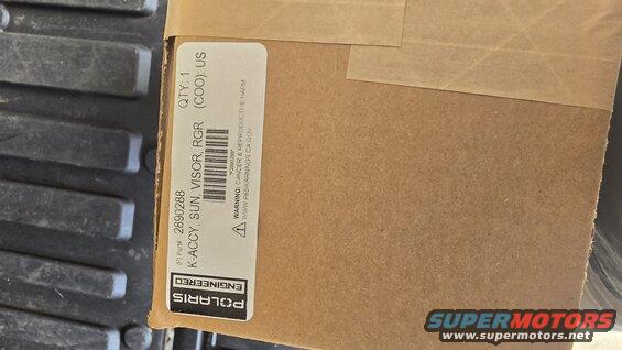 Cardboard box with label K-ACCY, SUN. VISOR, RGR (COO): US, Part # 2890288, QTY: 1