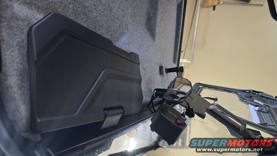 Polaris RANGER interior showing a black storage compartment and side mirrors