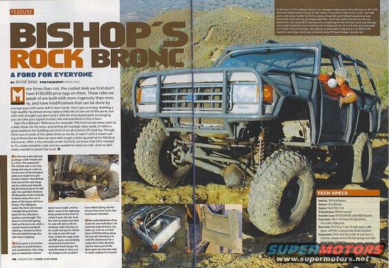 Modified 1990 Ford Bronco with roll cage and off-road tires on a dirt trail.