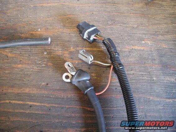 I had the Taurus wiring harness, which got me the plug and the boot for the charge cable.