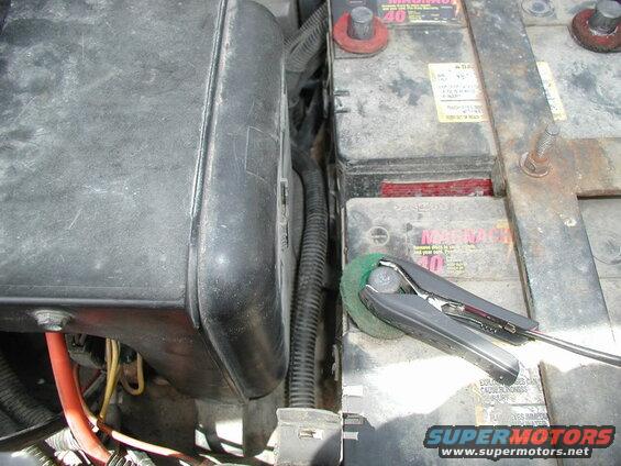 I ran the charge cable next to the batteries.