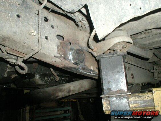 This is how the shackle tube goes through the frame.
