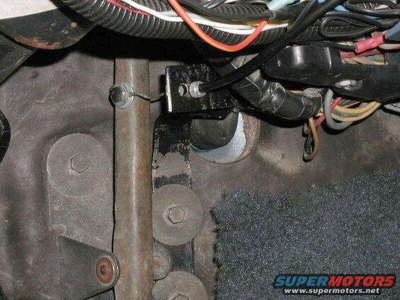 Close-up of vehicle footwell with cable and wiring