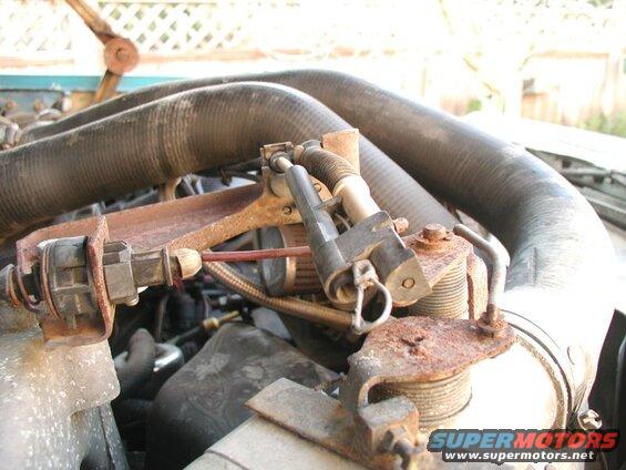 I ended up getting the shifter cable for a tandem bike. I ran the cable along side the accelerator cable, then through the plastic piece on the throttle body and tied it off with a crimp fitting.