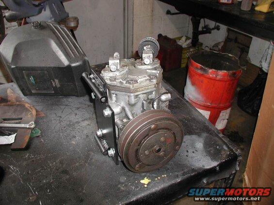 Bracket mounted to compressor.