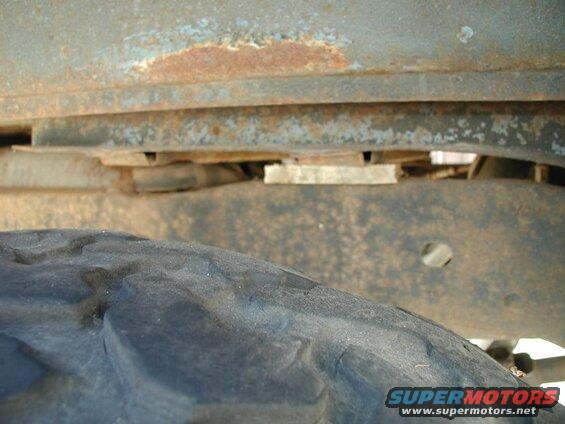 I jacked the body up enough to get a piece of wood under this crossmember to take some weight off the right rear body mounts while I was working.