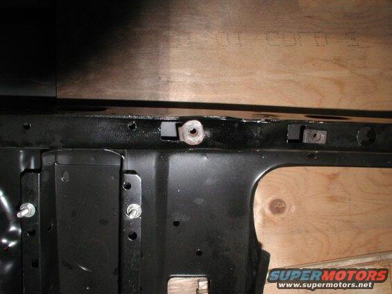 The left radiator mount nut after making the holes.