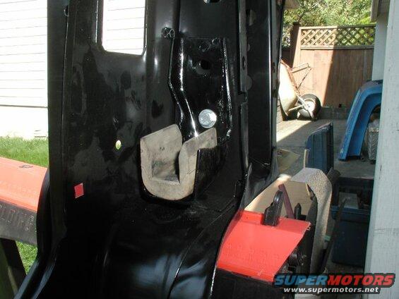The old radiator mounts bolted to the new radiator support.