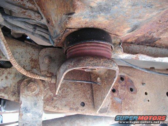 The two front cab mounts with the Super Duty rubbers in place; with full weight on them, they compressed to 1 15/16". I had to trim the bottom shoulder down to 1 3/4".