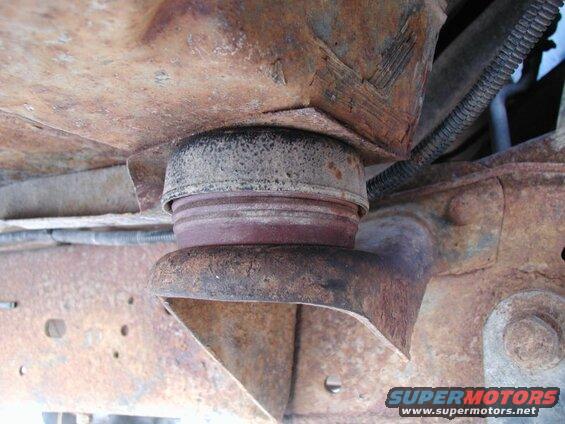 The two front cab mounts with the Super Duty rubbers in place; with full weight on them, they compressed to 1 15/16". I had to trim the bottom shoulder down to 1 3/4".