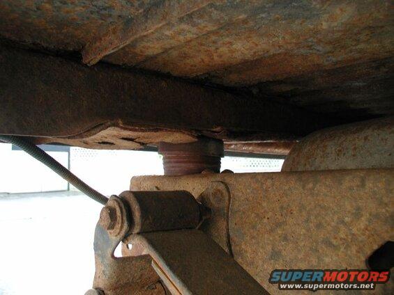 The two rear cab mounts with the Super Duty rubbers in place; with full weight on them, they compressed to 1 15/16". I had to trim the bottom shoulder down to just over 1 1/2".